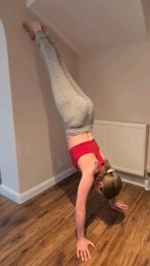 Practising hand-stand press-ups against a wall.  NOT your 'typical' heart attack patient's usual routine...